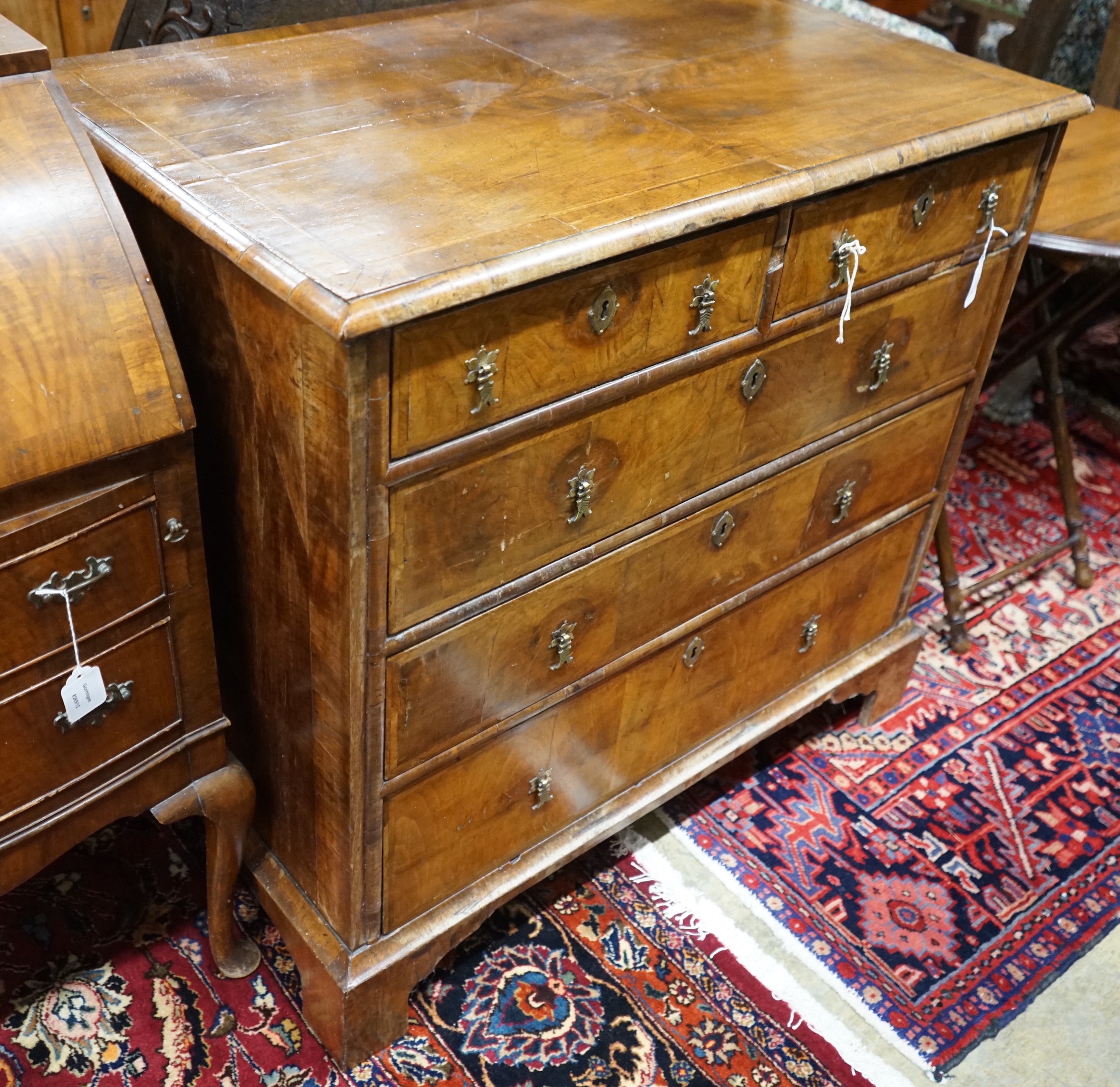 An 18th century feather banded walnut chest of two short and three long drawers, width 95cm, depth 58cm, height 92cm